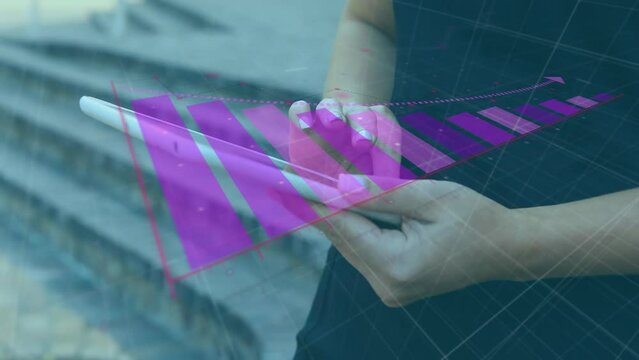 Animation of arrow on falling graphs, midsection of caucasian woman scrolling on digital tablet