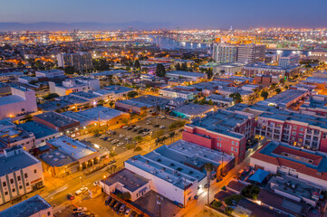 Aerial view of Downtown San Pedro facing Vincent Thomas Bridge and Long Beach at twilight