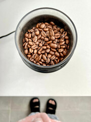 top view coffee beans in grinder machine