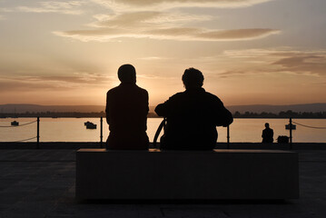 Person watching a sunset at sicily italy 