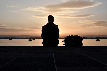 Person watching a sunset at sicily italy 