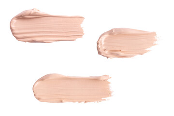 A smear of foundation cream or concealer isolated on white background, macro. Texture of cosmetic...