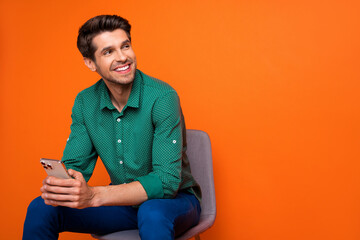 Photo of business worker content creator young man decide how sell his advertisement for subscribers isolated on orange color background