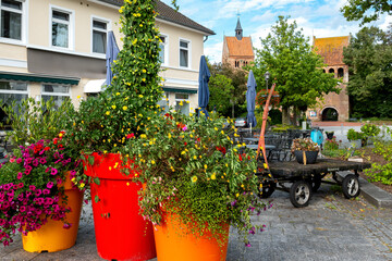 Cityscape of Bad Zwischenahn with beautiful flowers near the church, Germany