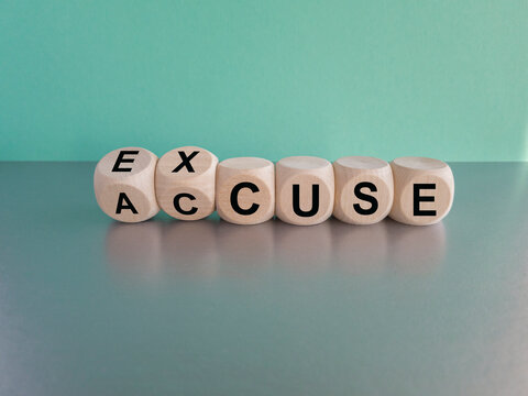 Accuse and excuse symbol. Turned cubes and changes the word accuse to excuse. Beautiful grey table blue background. Copy space.