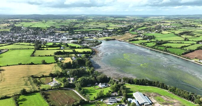 Flying over a lake with greenish seaweed growing underwater Lakes 4k