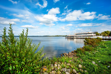 Bad Zwischenahn, Ammerland. Spa park and idyllic promenade with jetty and ship at the Zwischenahn Sea