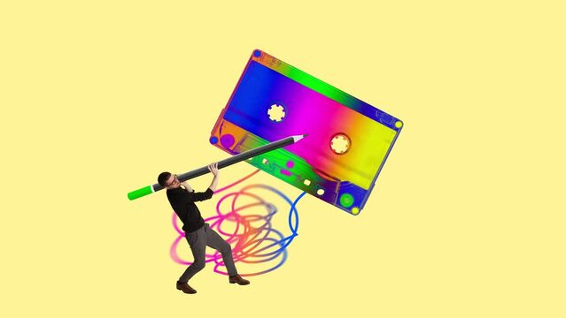Young man holding vintage cassette against light yellow background. Music player. Party time, fun. Stop motion, animation. Concept of retro and vintage style, inspiration, past, nostalgia, creativity