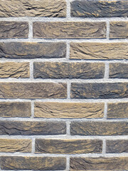 beige brick wall with detailed grooves