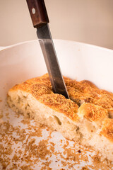 Close up of knife in piece of bread
