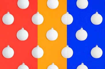 Collage of Christmas white bead on the colored background. Pattern. Flat lay.