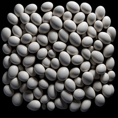 Fondo con detalle y textura de multitud de huevos de color blanco sobre fondo de color negro