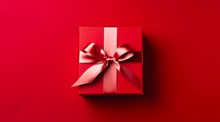 Top view on red gift box on red background. - obrazy, fototapety, plakaty