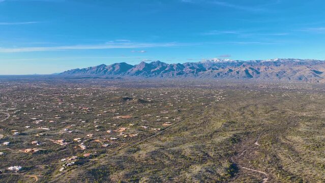 Panoramic view of Sonoran Desert landscape including Mt Lemmon in Santa Catalina Mountains and Rincon Mountains in Saguaro National Park east in city of Tucson, Arizona AZ, USA.