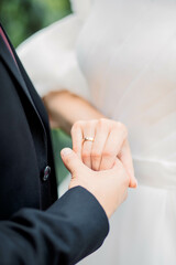 Hands of bride and groom with wedding rings 