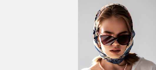 Fashionable girl in sunglasses and scarf. French style, fashion and beauty. Place for text,...