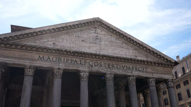 Low-angle view of pantheon roman temple facade, Piazza della Rotonda, Rome, Italy on sunny day. Latin inscription reads: M. Agrippa, son of Lucius, built this when he was consul for the third time
