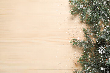 Beautiful Christmas tree branches and snow on wooden background with space for text - obrazy, fototapety, plakaty