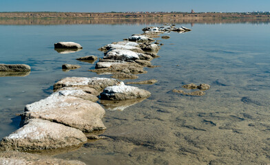 Dead Sea - Kuyalnik estuary, precipitation of self-precipitating salt on the rocks