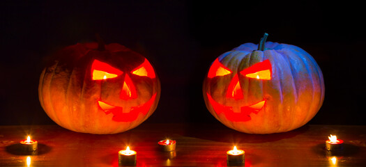 closeup halloween pumpkin with candles in dark, jack-o-lantern traditional holiday scene