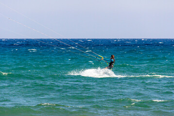sportsman practicing kitesurfing