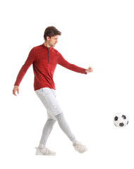 Handsome young man playing soccer on white background