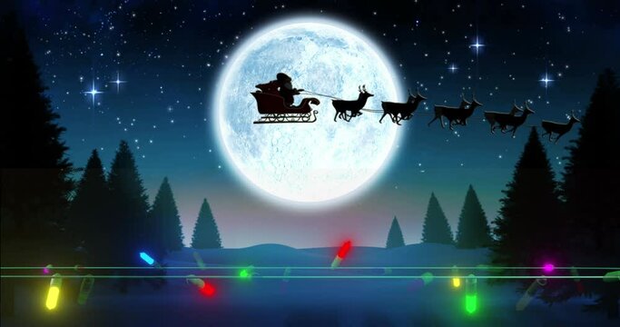Coloured christmas string lights flashing over winter scene with santa passing full moon in sleigh