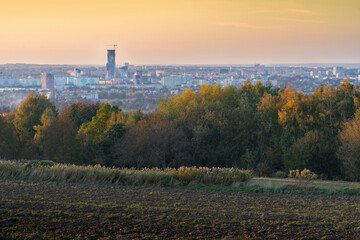 Rzeszów, Poland - panorama of the city in autumn. Sunset, orange tonation. Panorama includes the highest skyscrapper of Podkarpacie - Olszynki Towers. 