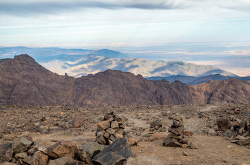 Fototapeta na wymiar Panorama from Toubkal, ridges and highest peaks of High Atlas mountain in Morocco