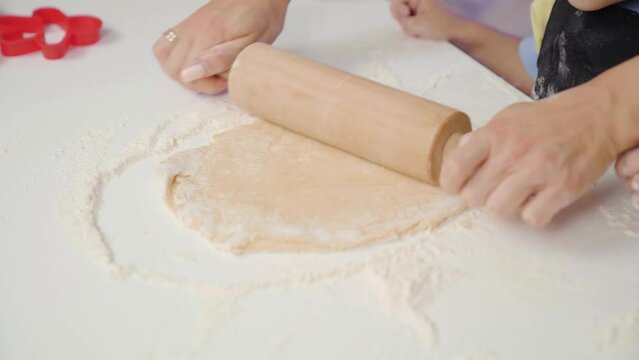 Close-up Rolling out dough on the table