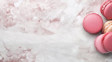 Pink macarons lie on marble surface with raspberries. Top view, copy space.