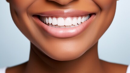 Beautiful black woman smiling with her healthy white teeth, close up of lower part of a dark skin beauty's face, concept of healthy teeth, oral product advertisement.