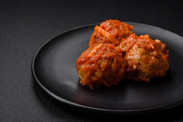 Delicious fresh meatballs from minced meat or fish with tomato sauce