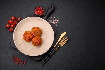 Delicious fresh meatballs from minced meat or fish with tomato sauce