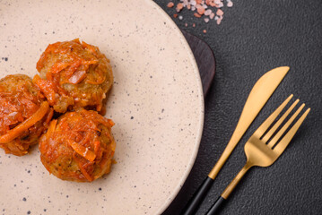 Delicious fresh meatballs from minced meat or fish with tomato sauce