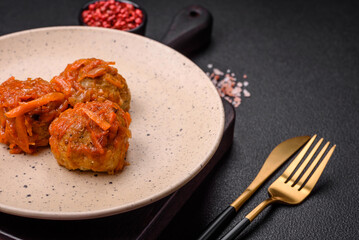 Delicious fresh meatballs from minced meat or fish with tomato sauce