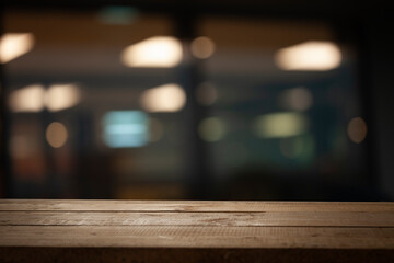 Empty dark wooden table in front of abstract blurred bokeh background of restaurant, window frames....