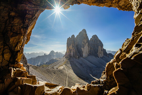 Tre Cime di Lavaredo (Drei Zinnen), famous three peaks in Dolomites during sunny day, cave view, Italy