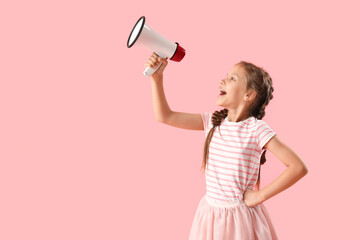 Little girl with megaphone on pink background