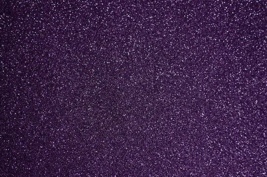 Fototapeta Fondo de brillos / textura glitter de color violeta/morado. Se puede usar como fondo de celebración, año nuevo o navidad.