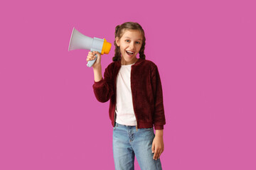 Little girl with megaphone on purple background