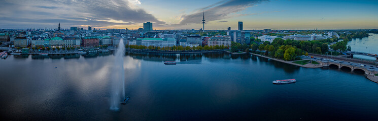Aerial view of Alster lake with fountain, framed by the striking TV tower and Hamburg skyline, with...