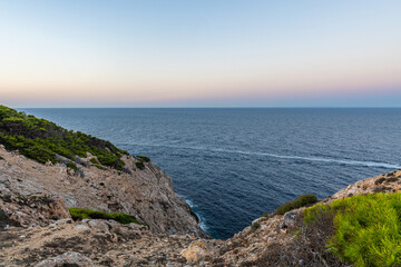 Fototapeta na wymiar The beautiful coast with the turquoise water of the Mediterranean Sea and stunning cliffs of Cala Ratjada on Majorca Island, Spain