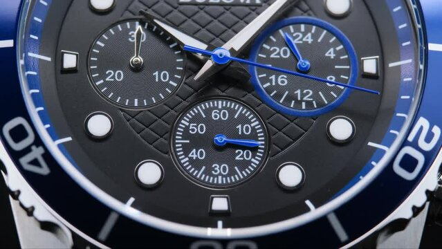 Close Up Of Stylish Luxury Man Wrist Watch With Moving Hand And Multiple Dials. Men's Swiss chronograph watch in metal with sapphire crystal. closeup view of rotating watch , running second arrow