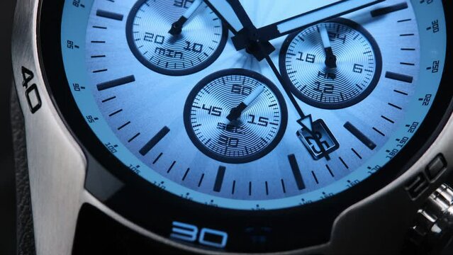 Close Up Of Stylish Luxury Man Wrist Watch With Moving Hand And Multiple Dials. Men's Swiss chronograph watch in metal with sapphire crystal. closeup view of rotating watch , running second arrow