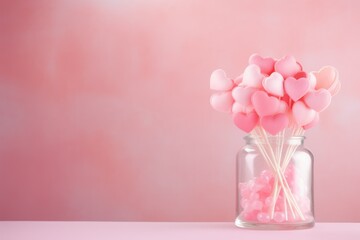pink background, there are heart-shaped candies in the jar. place for text. Valentine's Day card. declaration of love. aroma diffuser. wallpaper	
