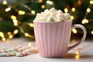 Fototapeten Christmas background. New Year wallpaper. Pastel mug of coffee with marshmallow and whipped cream. Warm light bulbs garlands bokeh. © Al