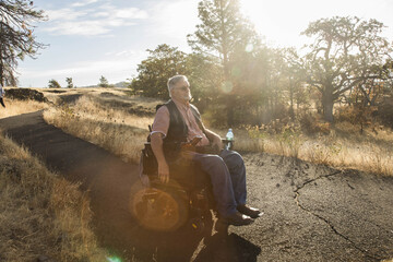 A man in a wheelchair enjoys nature along the Columbia River Gorge in Washington State.