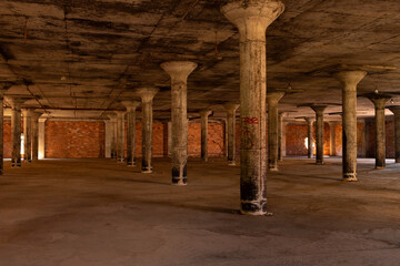 This abandoned warehouse sat completely empty with all of the cement pillars supporting the roof...