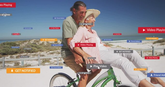 Animation of social media text and icons over caucasian couple riding bike on beach